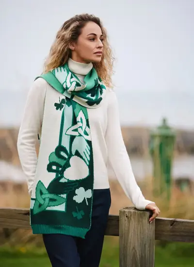 Woman wearing green and cream claddagh and trinity knot patrick francis scarf 